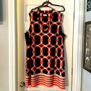 Sleeveless dress with ruffle neckline